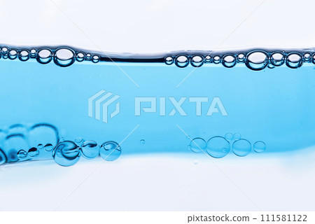 Close-up of bubbles in water, scientific background of cosmetic essence, serum under a microscope. Hydration The concept of developing cosmetics for skin care. Beauty Hydration background Close-up of bubbles in water, scientific background of cosmetic essence, serum under a microscope. Hydration The concept of developing cosmetics for skin care. Beauty Hydration background 111581122