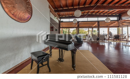 Panorama showing Interior of a modern hotel cafe bar restaurant with piano and fireplace timelapse Panorama showing Interior of a modern hotel cafe bar restaurant with piano and fireplace timelapse 111581128