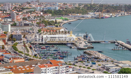 Aerial view of marina and city center timelapse in Setubal, Portugal. Aerial view of marina and city center timelapse in Setubal, Portugal. 111581149