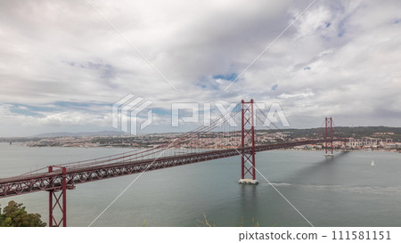 Panorama showing Lisbon cityscape and Tagus river timelapse with 25 of April bridge 111581151