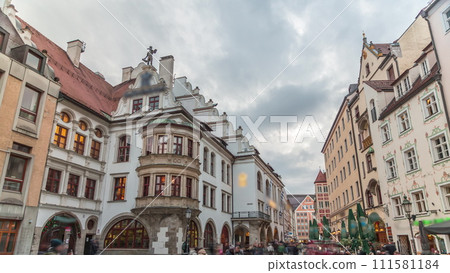Cityscape with bier houses and restaurants outdoors on Platzl timelapse in Munich, Bayern, Germany. 111581184