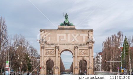 The Siegestor or Victory Gate in Munich is a memorial arch, crowned with a statue of Bavaria with a lion quadriga timelapse. Germany 111581208