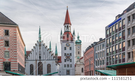 Marienplatz with the old Munich town hall and the Talburg Gate timelapse, Bavaria, Germany. 111581251