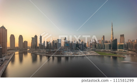 Cityscape with skyscrapers of Dubai Business Bay and water canal aerial timelapse. Cityscape with skyscrapers of Dubai Business Bay and water canal aerial timelapse. 111581299