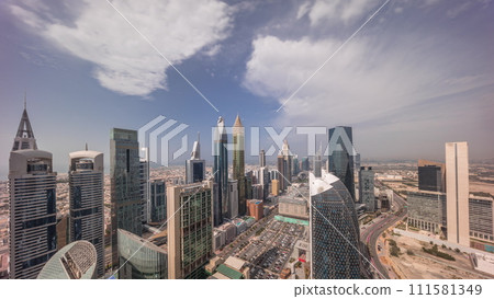 Skyline view of the high-rise buildings on Sheikh Zayed Road in Dubai aerial all day timelapse, UAE. 111581349