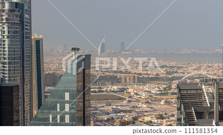 High-rise buildings on Sheikh Zayed Road in Dubai aerial timelapse, UAE. High-rise buildings on Sheikh Zayed Road in Dubai aerial timelapse, UAE. 111581354