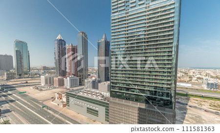 Aerial view of Dubai Downtown skyline with many towers timelapse. 111581363