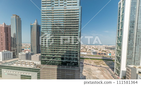 Aerial view of Dubai Downtown skyline with many towers timelapse. 111581364