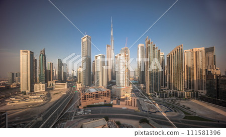 Aerial view of Dubai Downtown skyline with many towers all day timelapse. Aerial view of Dubai Downtown skyline with many towers all day timelapse. 111581396