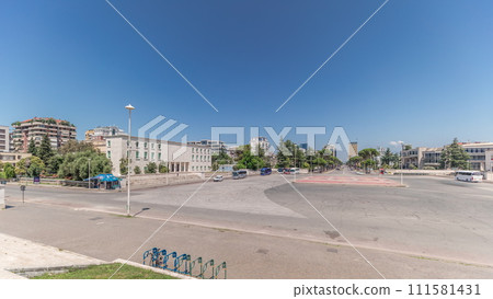 Panorama showing traffic on the Deshmoret e Kombit Boulevard in Tirana timelapse. 111581431
