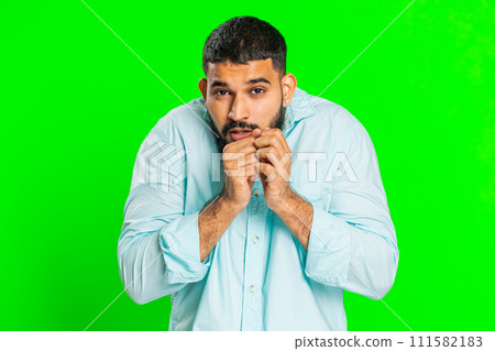 Scared fearful depressed Indian man suffering phobia, anxiety disorder, expresses fear, stress panic 111582183