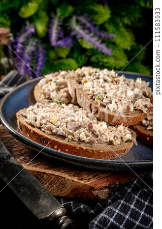 Sandwich with tuna paste and eggs. 111583933