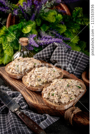 Sandwich with tuna paste and eggs. 111583936