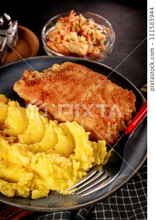 Fried cod fillet served. 111583944