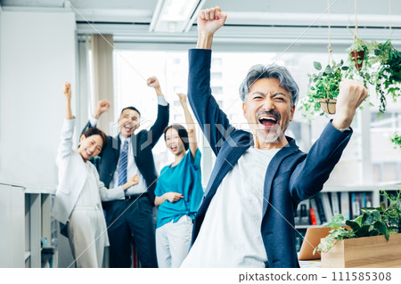 Business team happy to achieve their goals Business team happy to achieve their goals 111585308