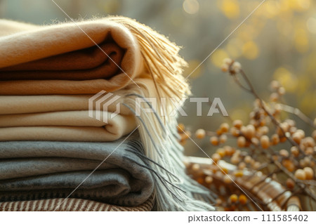 Stack of wool or cashmere blankets. Autumn and winter concept. Generative AI 111585402