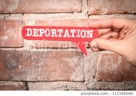 Deportation. Red speech bubble with text on a red brick background 111586080