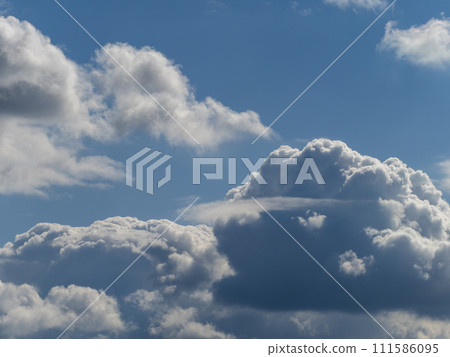 snow clouds floating in the blue sky 111586095