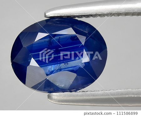 natural blue sapphire gem on the background 111586899