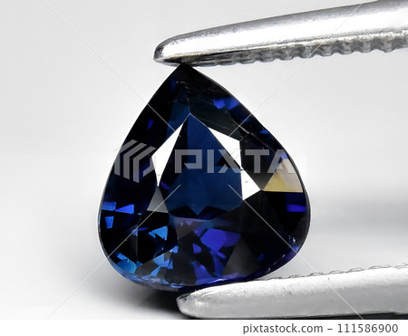 natural blue sapphire gem on the background natural blue sapphire gem on the background 111586900