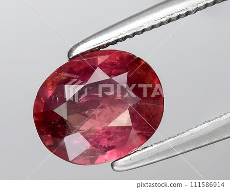 natural pink padparadscha sapphire gem on the background natural pink padparadscha sapphire gem on the background 111586914