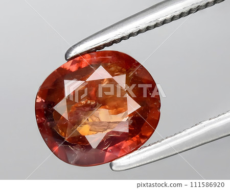 natural brown sapphire gem on the background 111586920