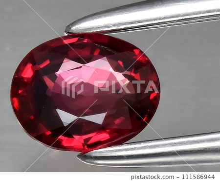natural red ruby gem on the background 111586944