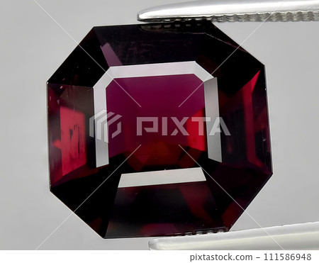 natural red tourmaline rubellite gem on the background natural red tourmaline rubellite gem on the background 111586948