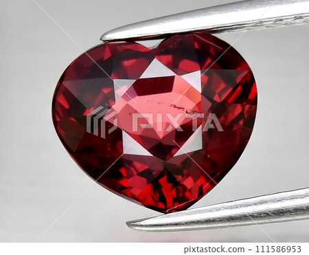 natural red rhodolite garnet gem on the background natural red rhodolite garnet gem on the background 111586953