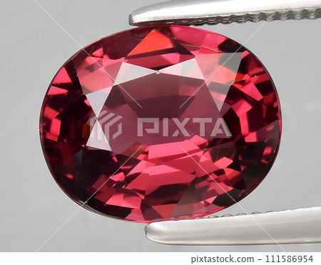 natural red rhodolite garnet gem on the background 111586954