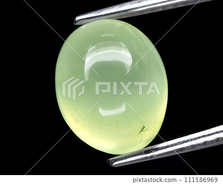 natural green prehnite gem on the background natural green prehnite gem on the background 111586969