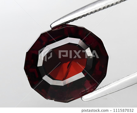 natural orange garnet gem on the background 111587032