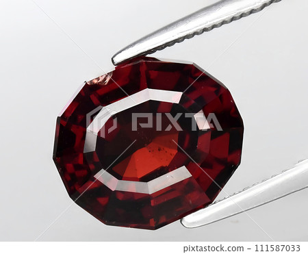 natural orange garnet gem on the background 111587033