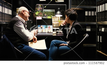 Agents meet with witnesses on videocall, conducting investigation and writing statements to help in solving criminal case. Partners using online telework videoconference to interview people. Agents meet with witnesses on videocall, conducting investigation and writing statements to help in solving criminal case. Partners using online telework videoconference to interview people. 111587902
