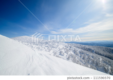 Spectacular winter view of Mt. Moriyoshi, the summit and distant Akita Komagatake, Akita Prefecture 111590370