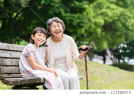 Senior playing with grandson Senior playing with grandson 111590573