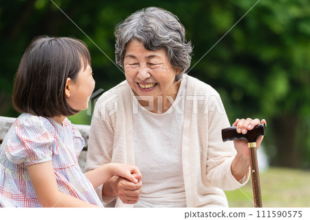 Senior playing with grandson Senior playing with grandson 111590575