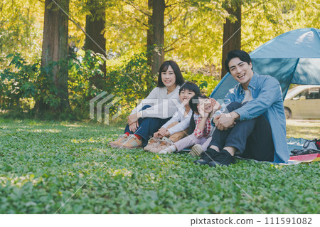 playing in the park with family 111591082