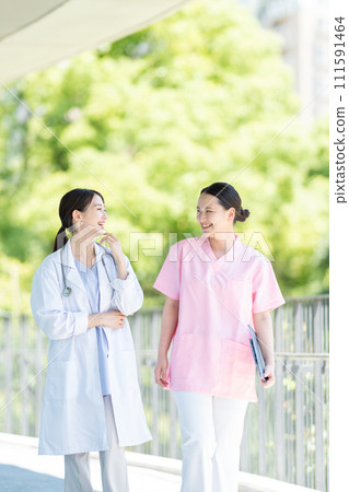 Nurse and female doctor working at a hospital Nurse and female doctor working at a hospital 111591464