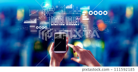 Digital Wallet theme with person using a smartphone at night Digital Wallet theme with person using a smartphone at night 111592185