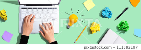 Laptop Computer with a light bulb 111592197