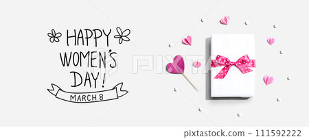 Happy Womens day message with a gift box and hearts Happy Womens day message with a gift box and hearts 111592222