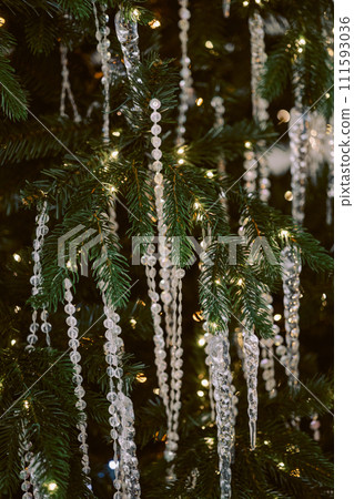 parkling Christmas tree with crystal garlands. parkling Christmas tree with crystal garlands. 111593036