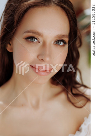 Portrait brunette woman, smiling and looking confident in camera.  111593038