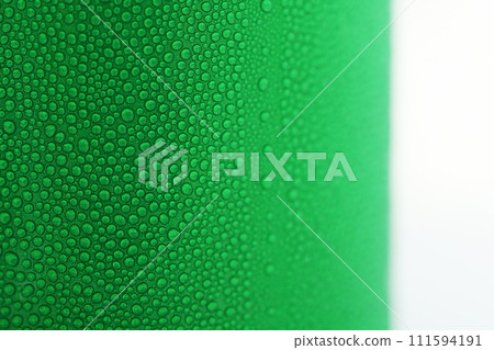 water drop on green beverage cans background, texture of cold aluminium package water drop on green beverage cans background, texture of cold aluminium package 111594191