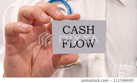 Cash flow text written on a white card in the hands of a businessman 111596695