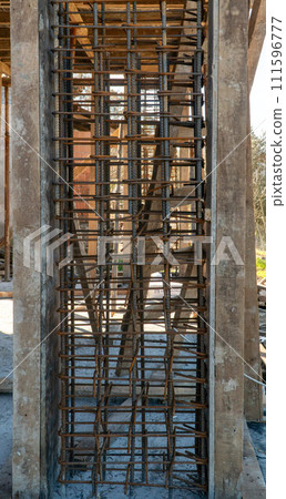 Reinforcement rebar steel rods of a column ready for concrete pouring at a construction site 111596777
