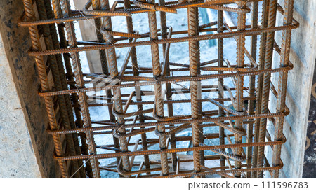 Reinforcement rebar steel rods of a column ready for concrete pouring at a construction site 111596783
