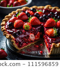 Delicious sliced wild fruits tart, top shot Delicious sliced wild fruits tart, top shot 111596859
