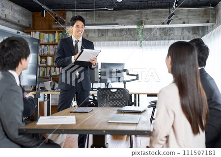 Businessman working as a team leader at a meeting Businessman working as a team leader at a meeting 111597181